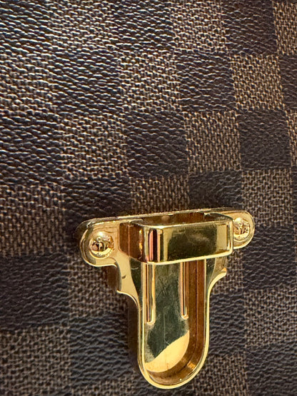 Louis Vuitton Clapton Backpack — Tight detail of lower gold-tone closure and textured canvas