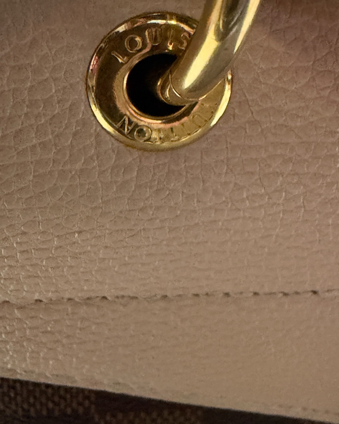 Louis Vuitton Clapton Backpack — Louis Vuitton-engraved gold-tone handle ring and leather stitching detail