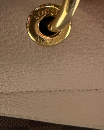 Louis Vuitton Clapton Backpack — Louis Vuitton-engraved gold-tone handle ring and leather stitching detail
