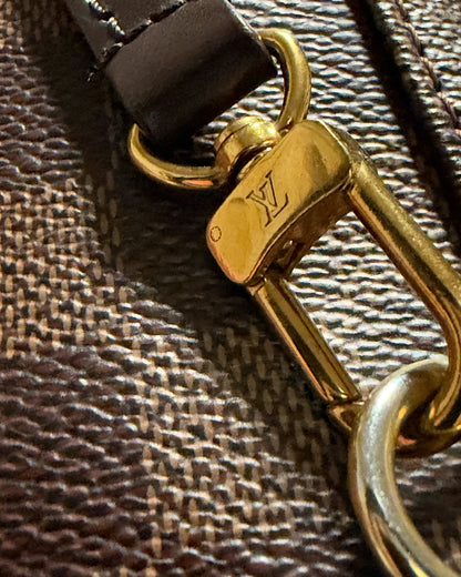 Louis Vuitton Clapton Backpack — LV-engraved gold-tone swivel clasp attached to brown leather strap