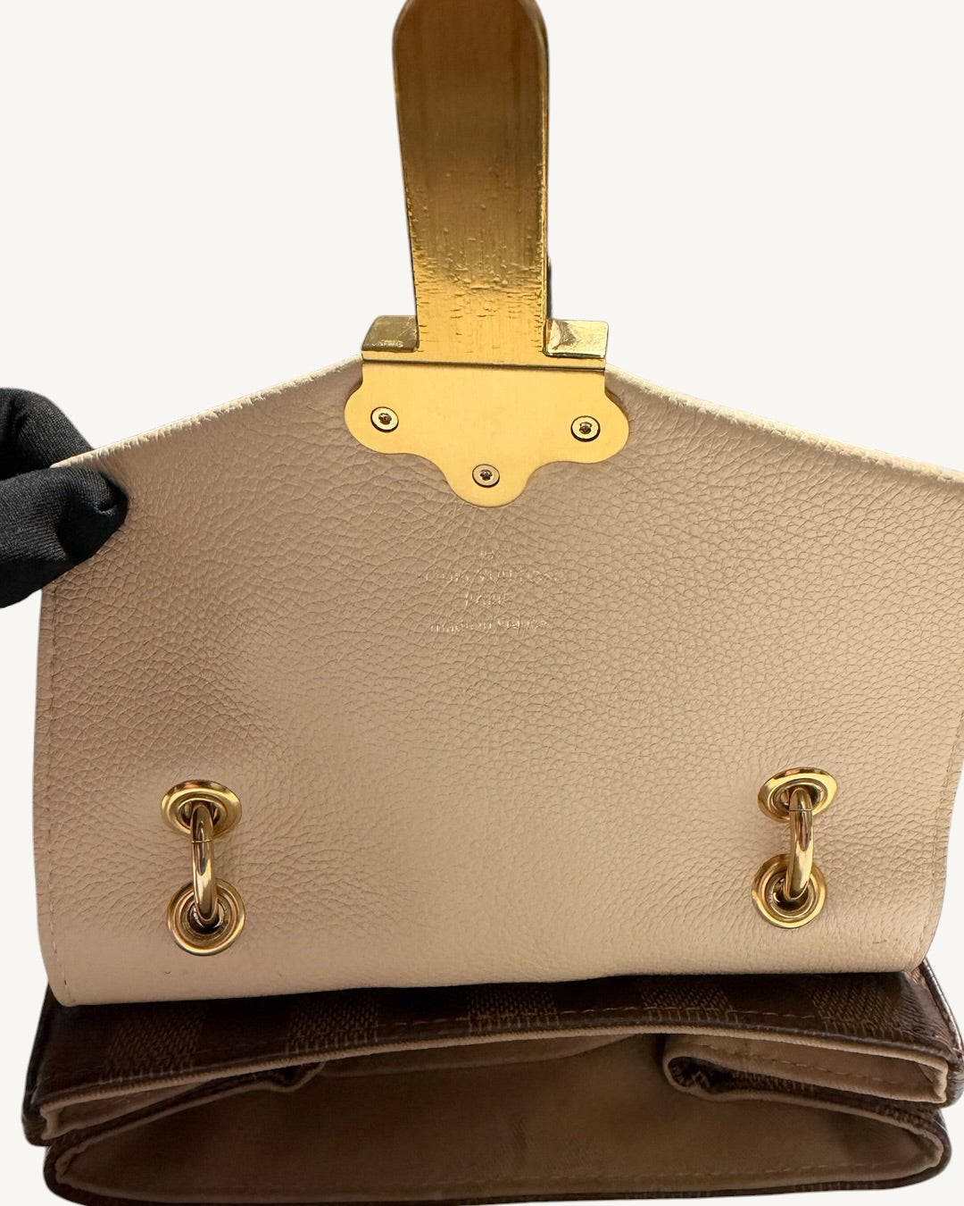 Louis Vuitton Clapton Backpack — Inside leather flap with closure backing, handle rings and brand stamp
