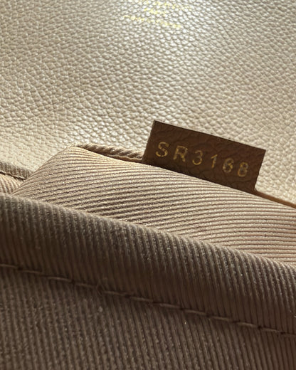 Louis Vuitton Clapton Backpack — Leather date-code tab stamped SR3168 beside interior textile lining
