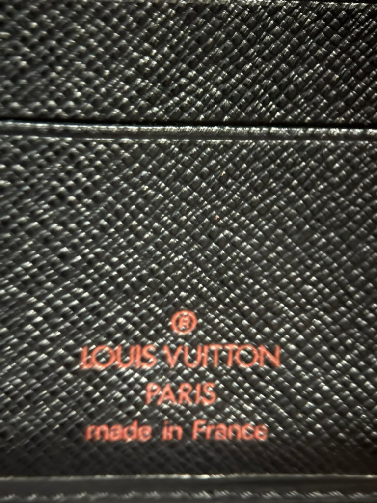 Louis Vuitton Paris made in France stamp on black cross-grain leather interior