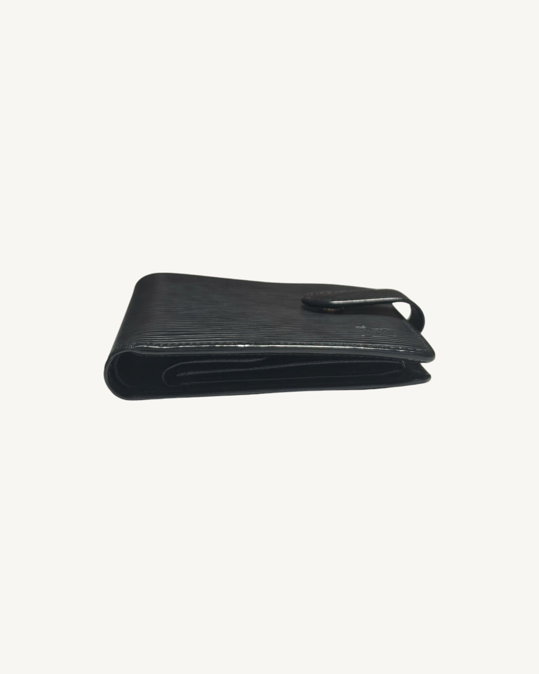 Edge profile of Louis Vuitton black Epi wallet showing layered leather compartments