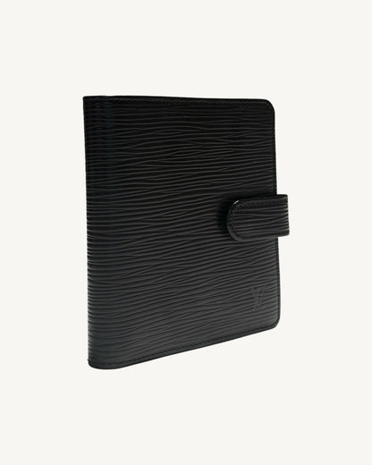 Angled front view of Louis Vuitton black Epi leather wallet showing textured leather and snap-tab closure