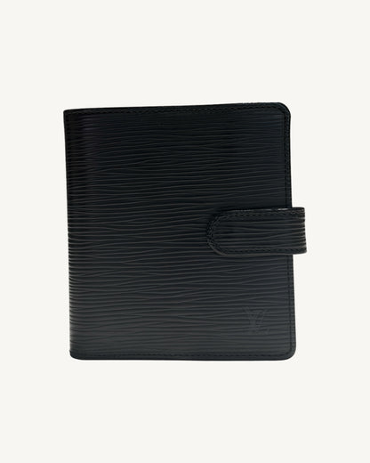 Front of Louis Vuitton black Epi leather compact bifold wallet with leather snap tab and embossed LV logo