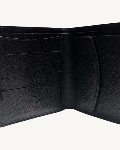 Close-up of black cross-grain leather interior with card slots and Louis Vuitton stamp