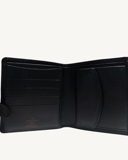 Open Louis Vuitton black leather bifold wallet showing card slots and closed coin pocket