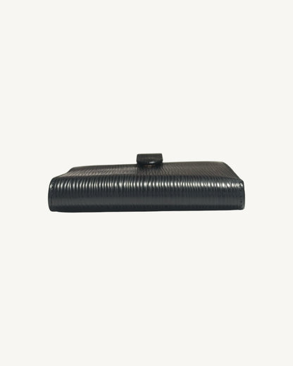 Folded spine of Louis Vuitton black Epi leather compact wallet