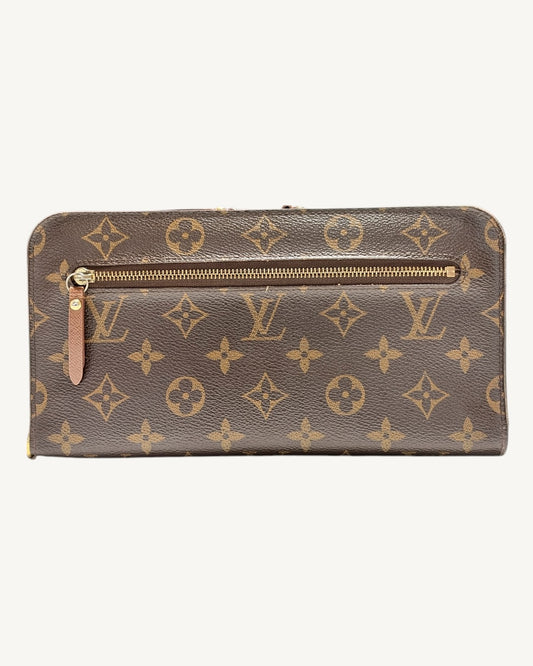 Brown Monogram Insolite wallet exterior with horizontal zip pocket and leather zipper pull