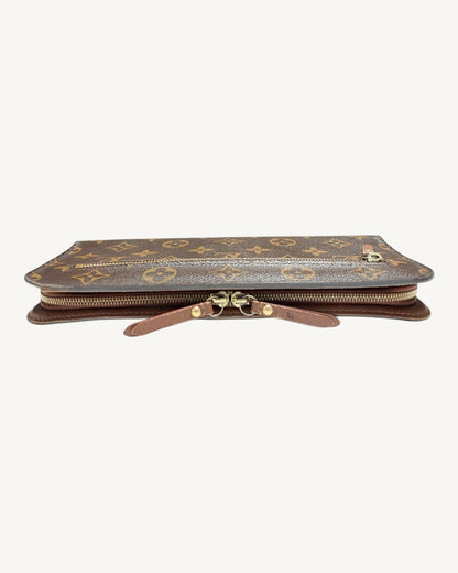 Louis Vuitton Insolite wallet edge view showing two leather zipper pulls meeting at the center