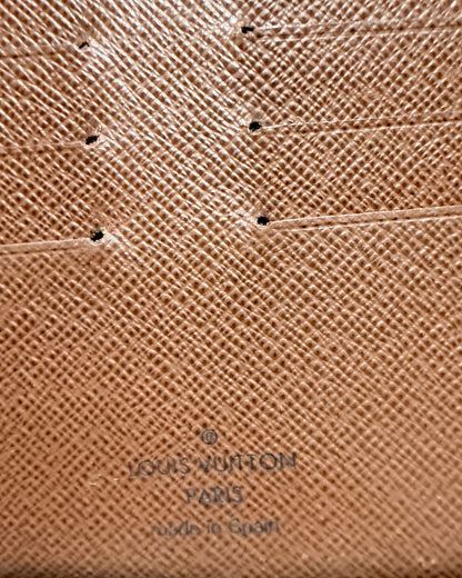 Close-up of Louis Vuitton Paris made in Spain interior stamp beneath card slot stitching