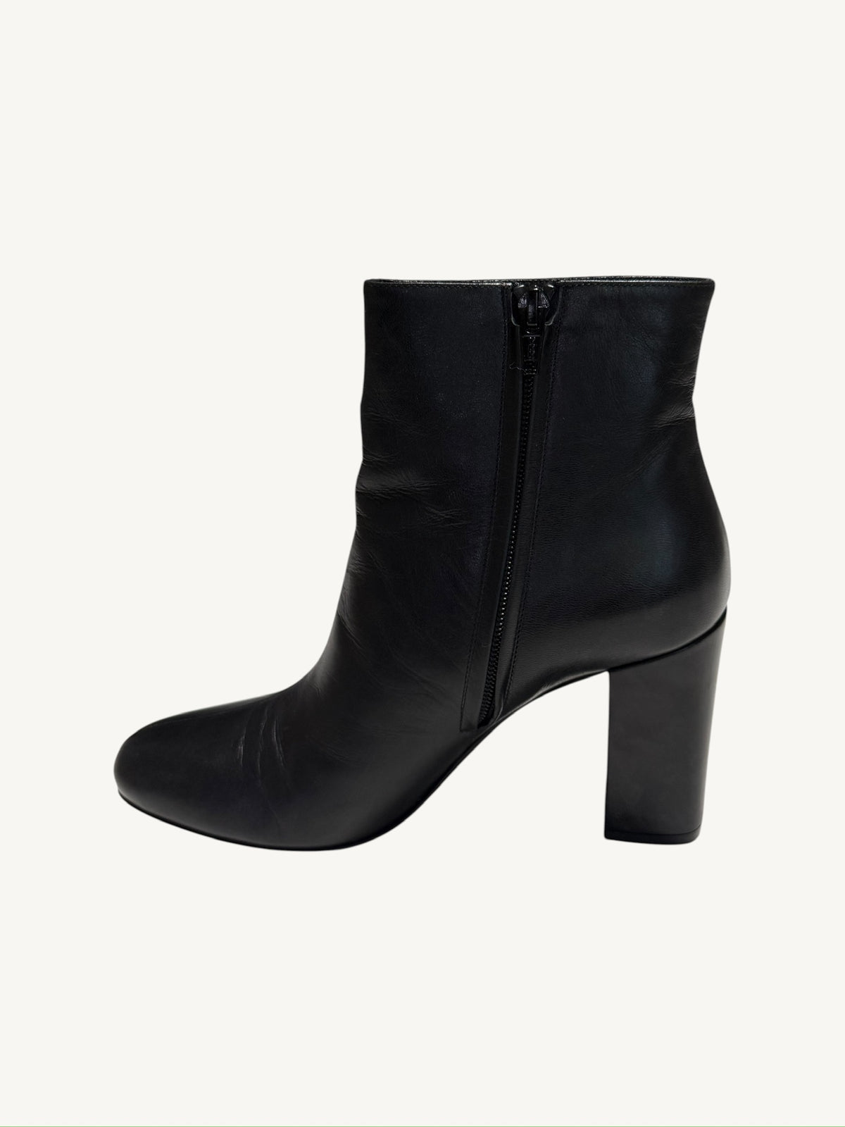 Opposite side profile of a Saint Laurent Lou 95 black calfskin ankle boot with interior zipper
