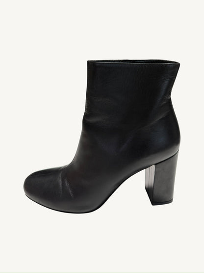 Opposite outer side view of a Saint Laurent Lou 95 black calfskin ankle boot