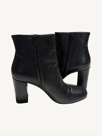 Saint Laurent Lou 95 black ankle boots showing the interior side zippers and block heels